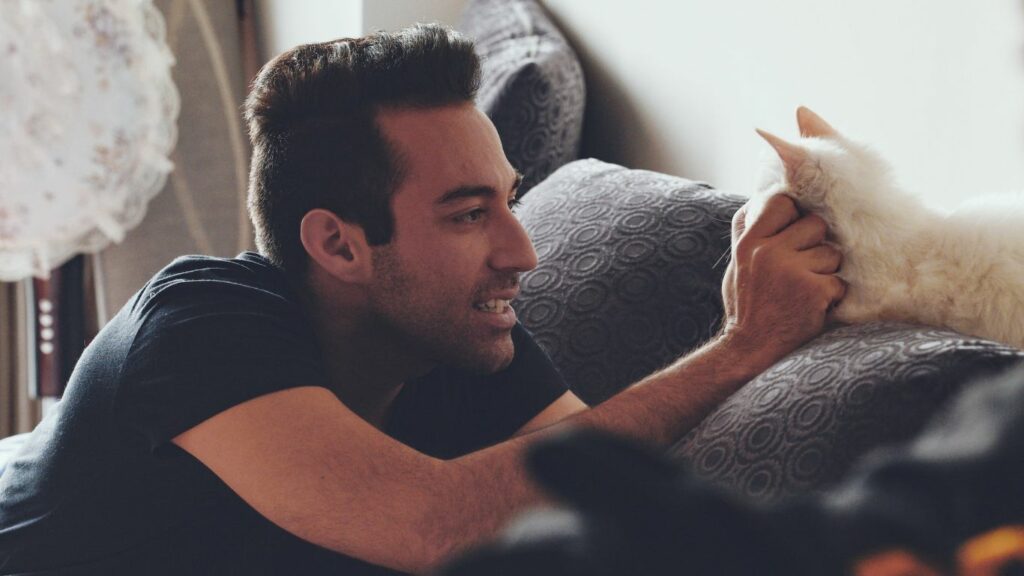 a man with a cat